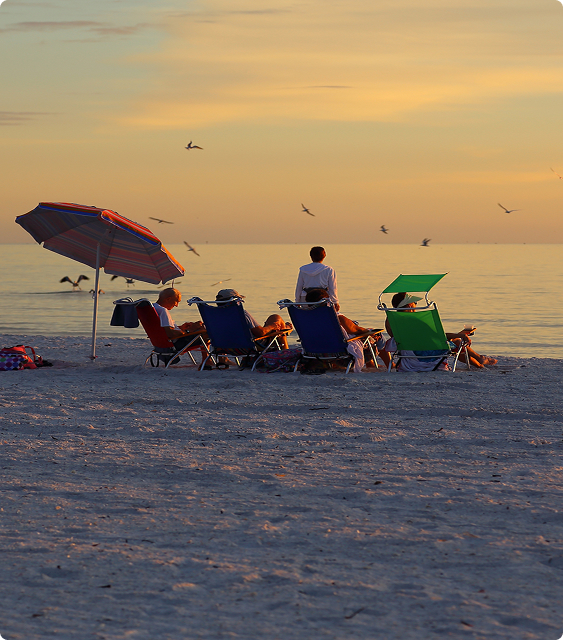 Family on the beach at sunset Family on the beach at sunset